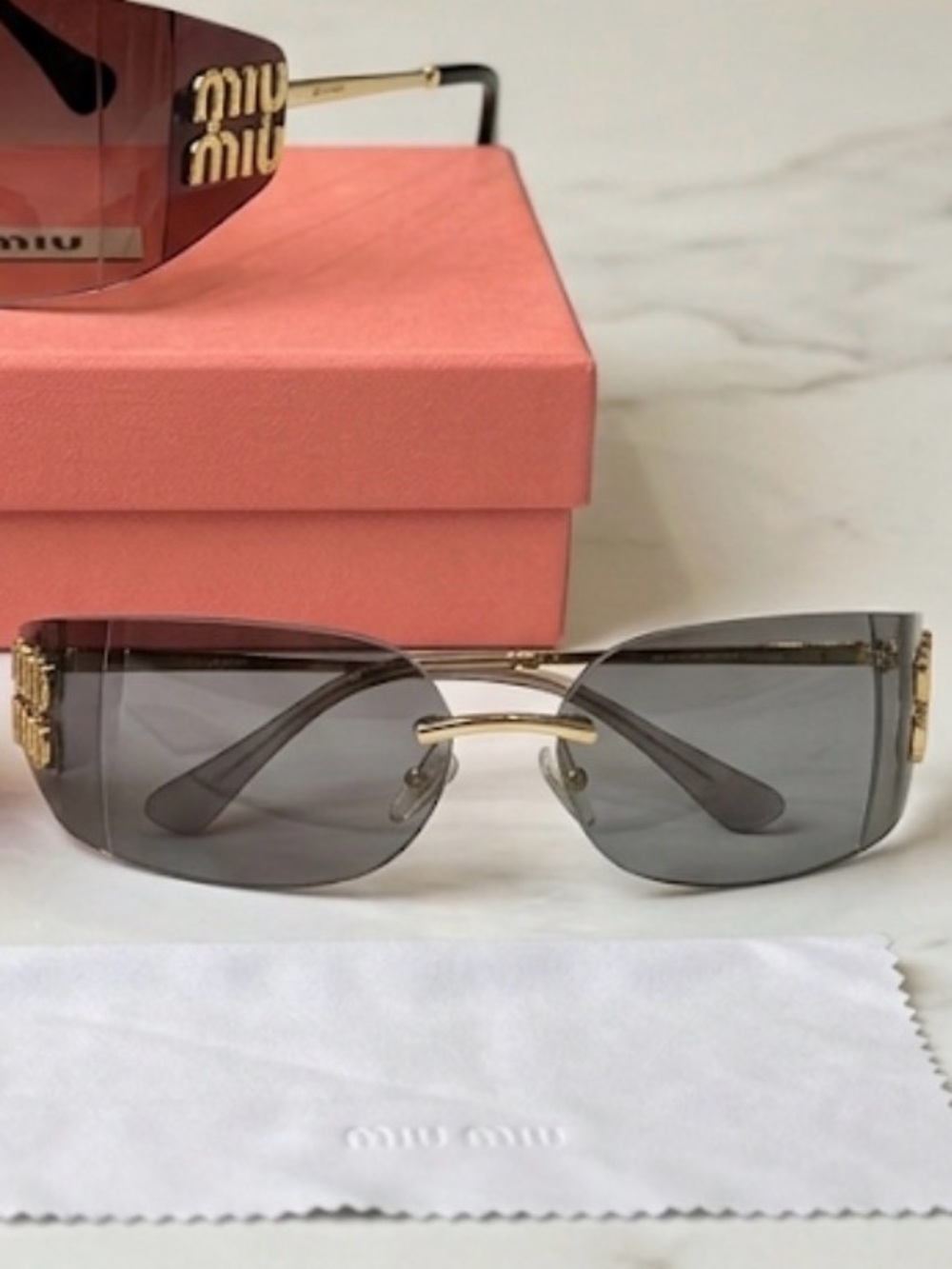 Women’s Gray Rimless Sunglasses with Gold Accents